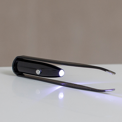 VIVITAR<sup>&reg;</sup> Vivaspa Lighted Tweezers - These stainless steel tweezers come equipped with a super bright LED light for precise grooming. Operates on 3 LR41 batteries (included).